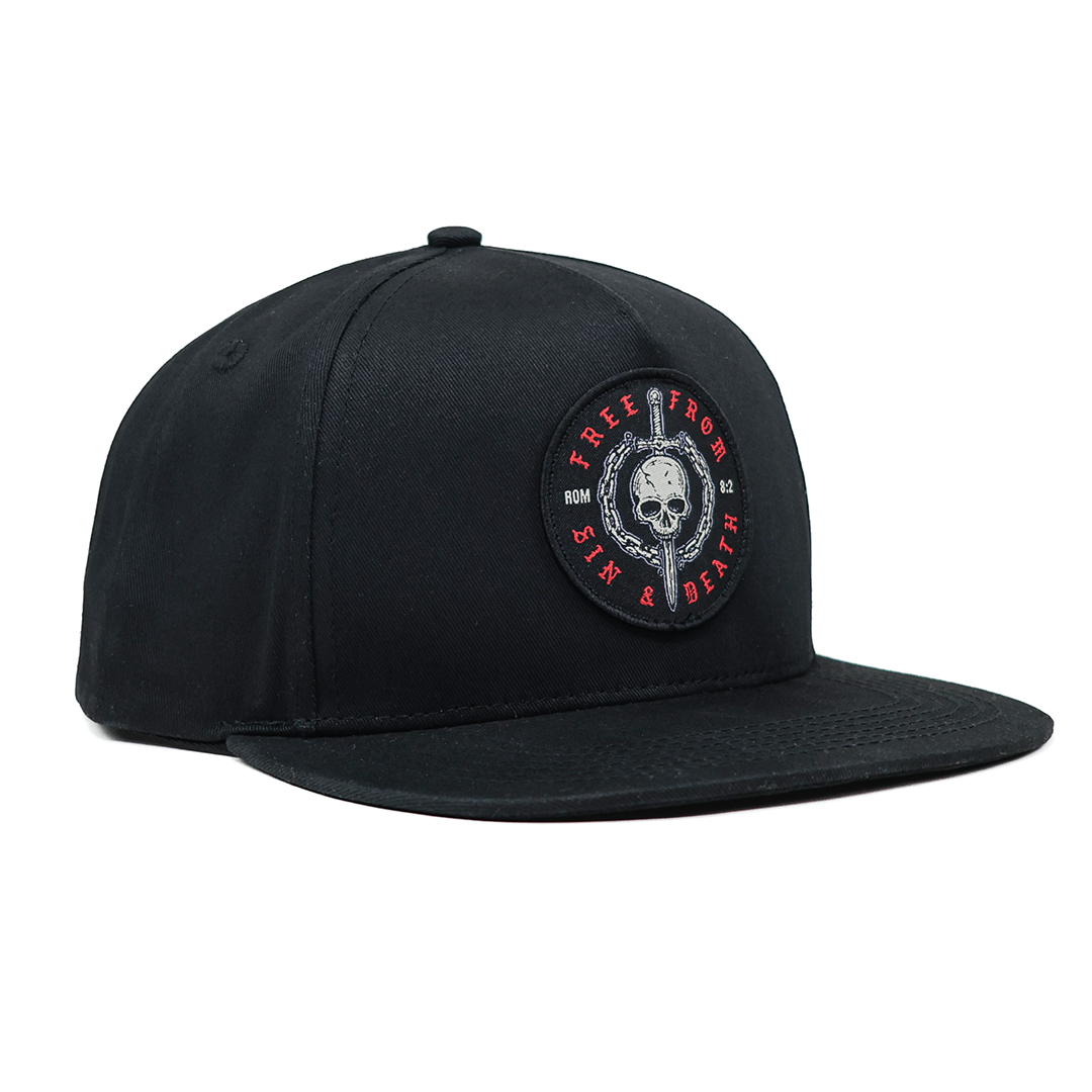 Black cap with a skull and sword design on a white background