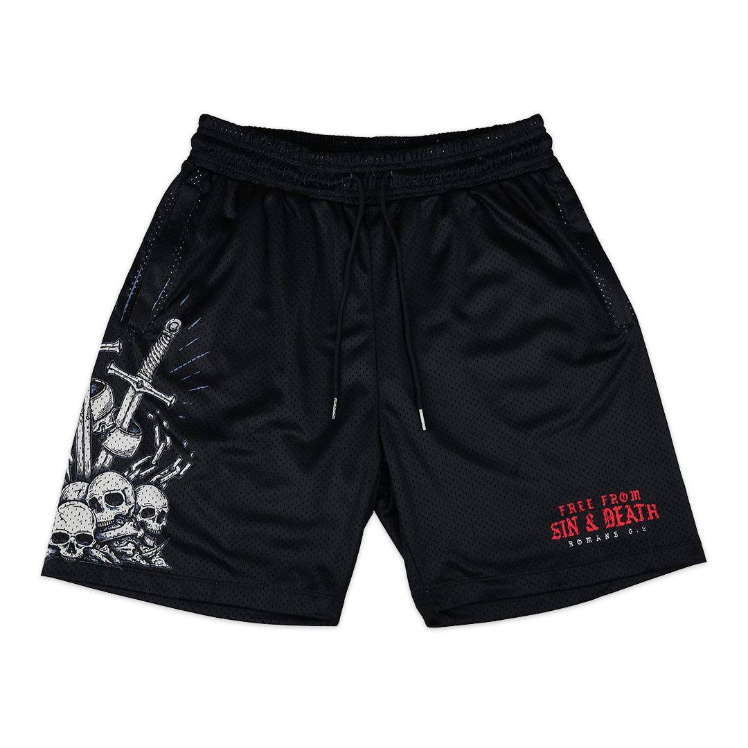 Black Christian shorts based on Romans 5:8 with skull and crossbones design on a white background.