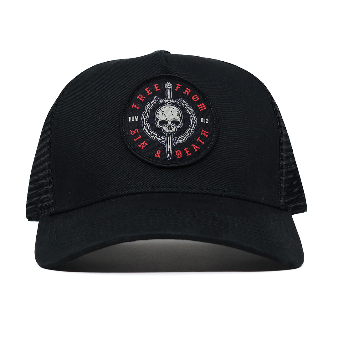 Black cap with a skull and sword design on a white background