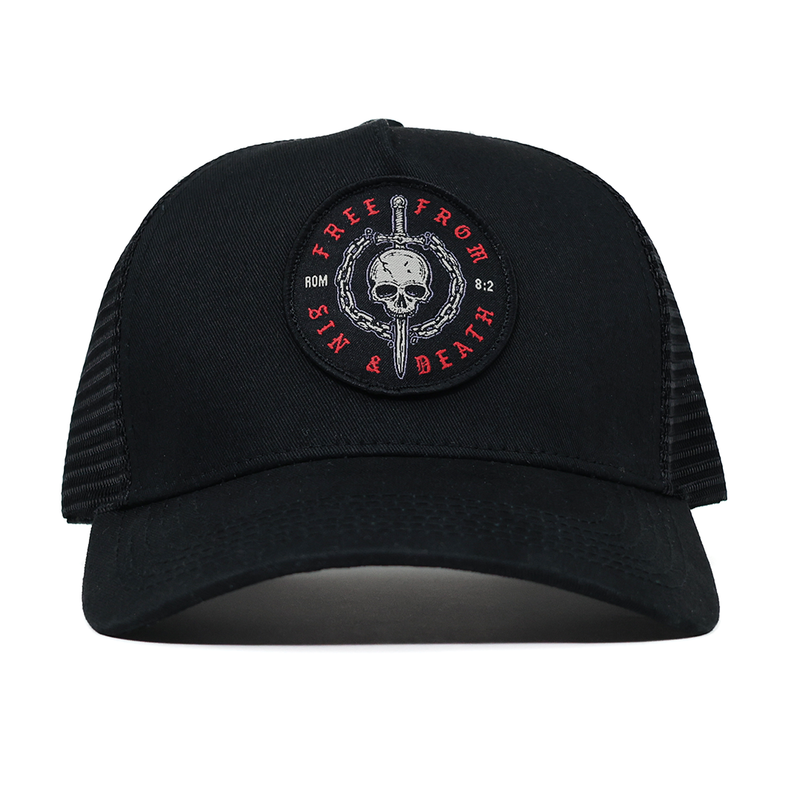 Black cap with a skull and sword design on a white background
