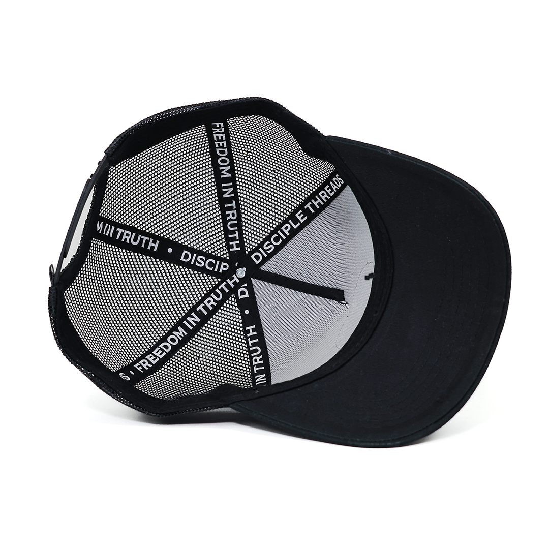 Black cap with mesh back and text design on a white background