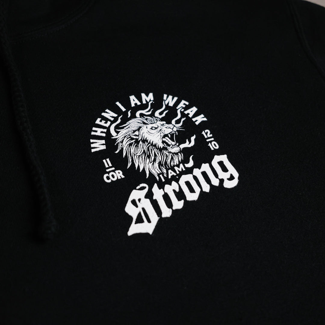 Black hoodie with white lion graphic and text on a dark background