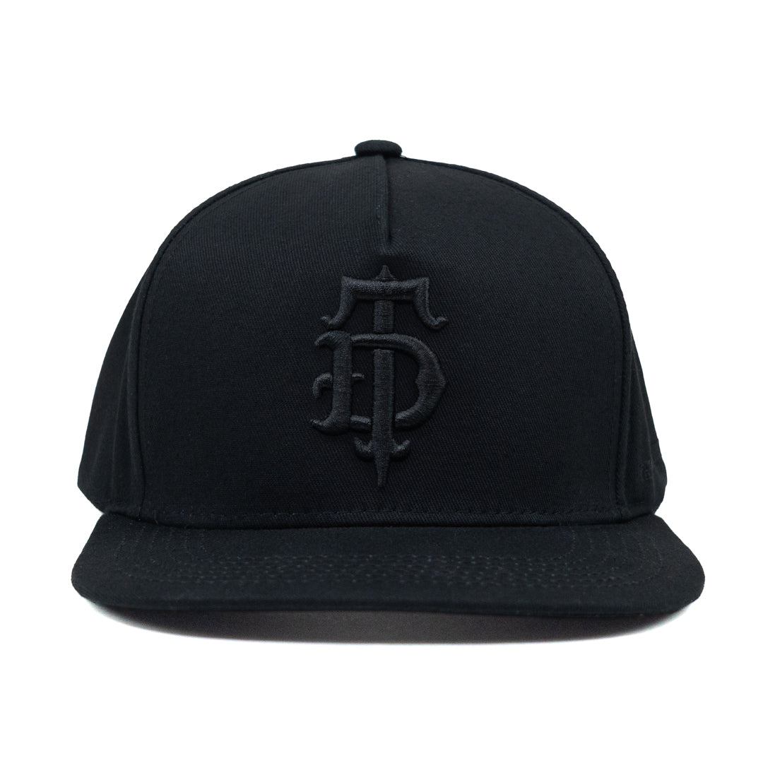 Black on black puff embroidered Disciple Threads monogram logo flat bill hat. Features "Freedom in Truth" embroidered on the side.