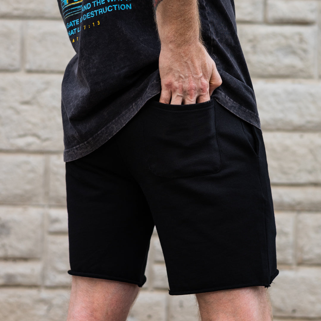 Cut-off sweat shorts with back pocket.