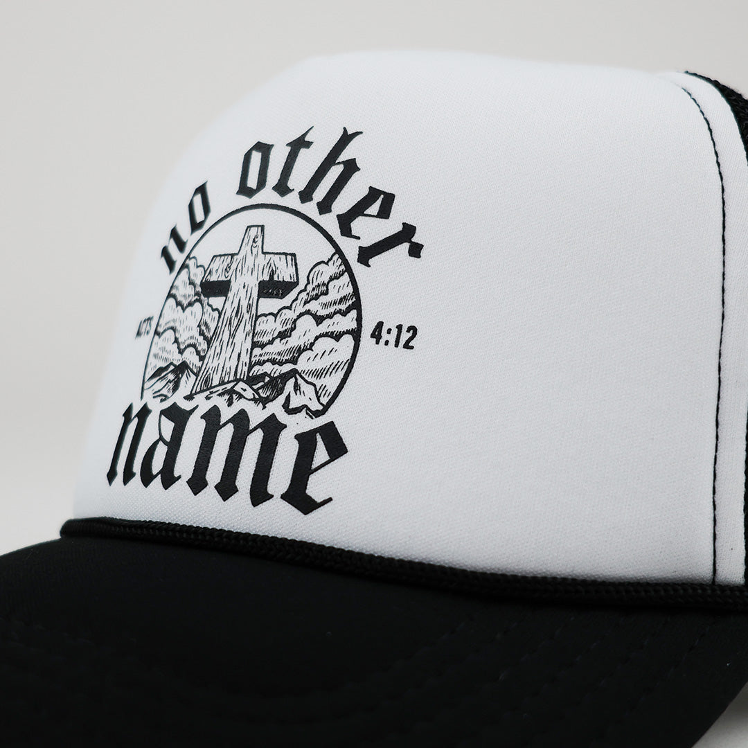 Black and white cap with cross design and text on a white background