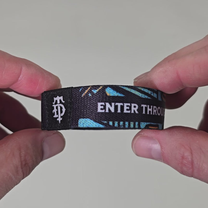 Video showing stretchy bracelet with scripture and artwork.